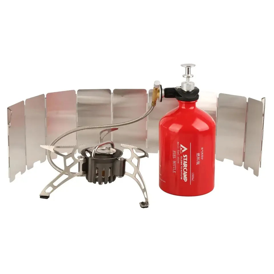 Portable camping stove with red fuel canister on a white background