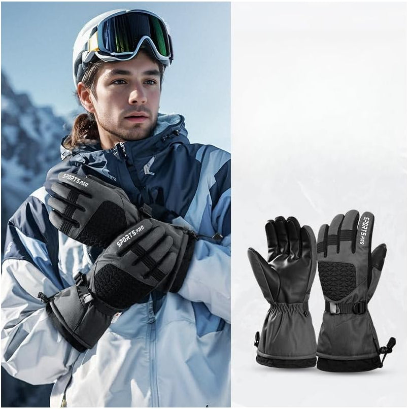 Person wearing ski goggles and gloves with a mountain background, showing close-up of gloves on a white background.